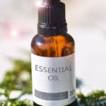 Glass bottle of essential oil representing aromatherapy for relaxation, mood support, and energy healing