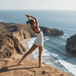 Woman performing stretching routine to extend massage therapy benefits